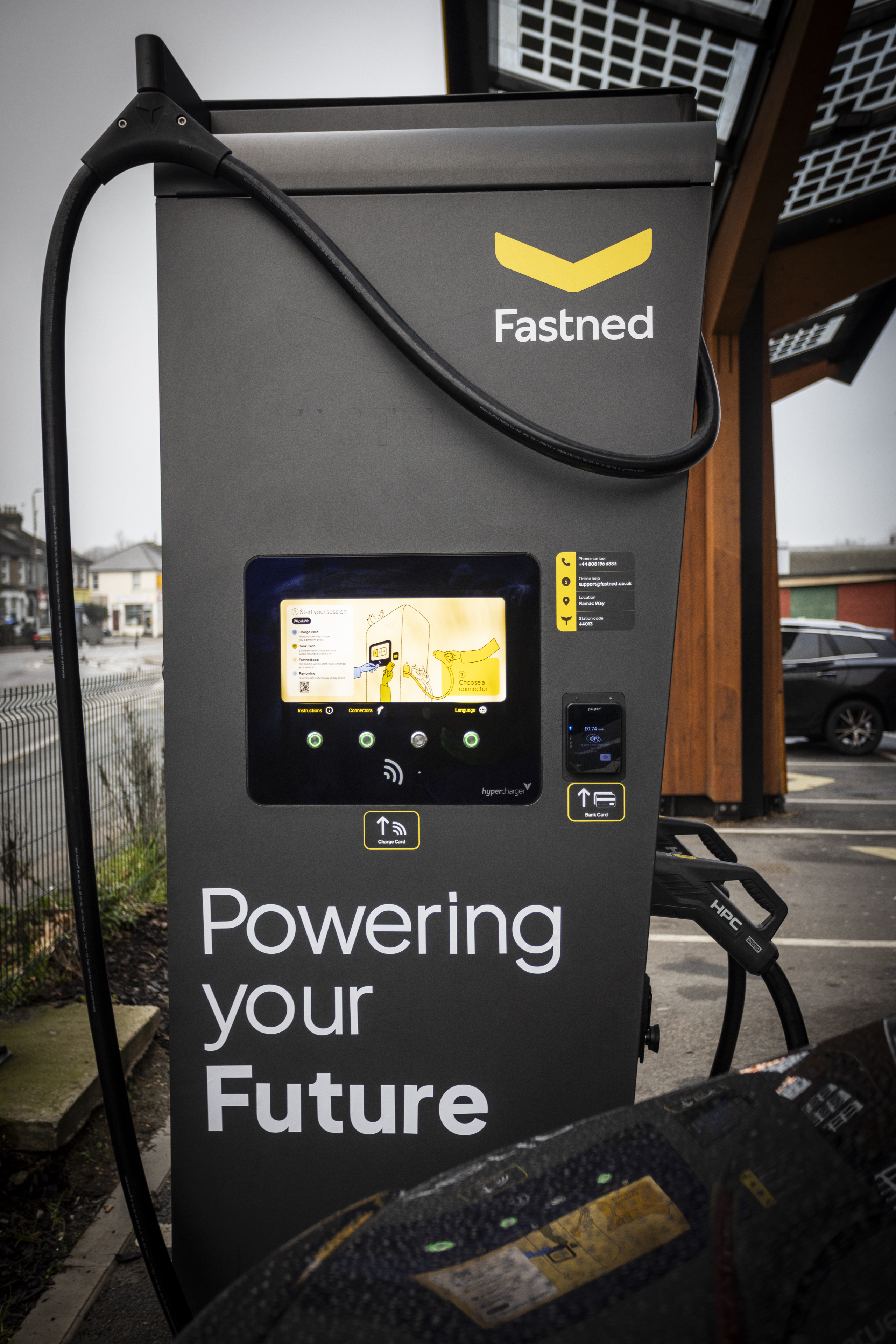 Electric vehicle charging point with charging cable and touchscreen display