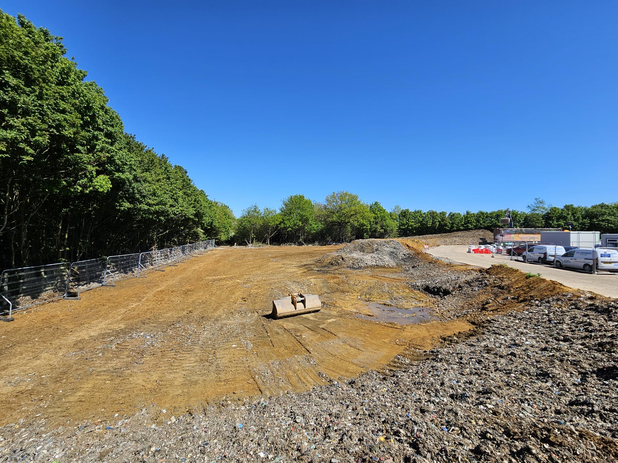 an image showing the same section of waste dug to ground level from a different angle