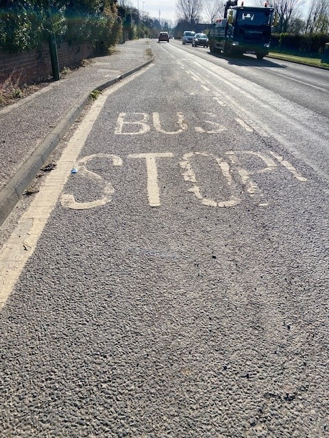 bus stop written on the road to mark the bus stop layby