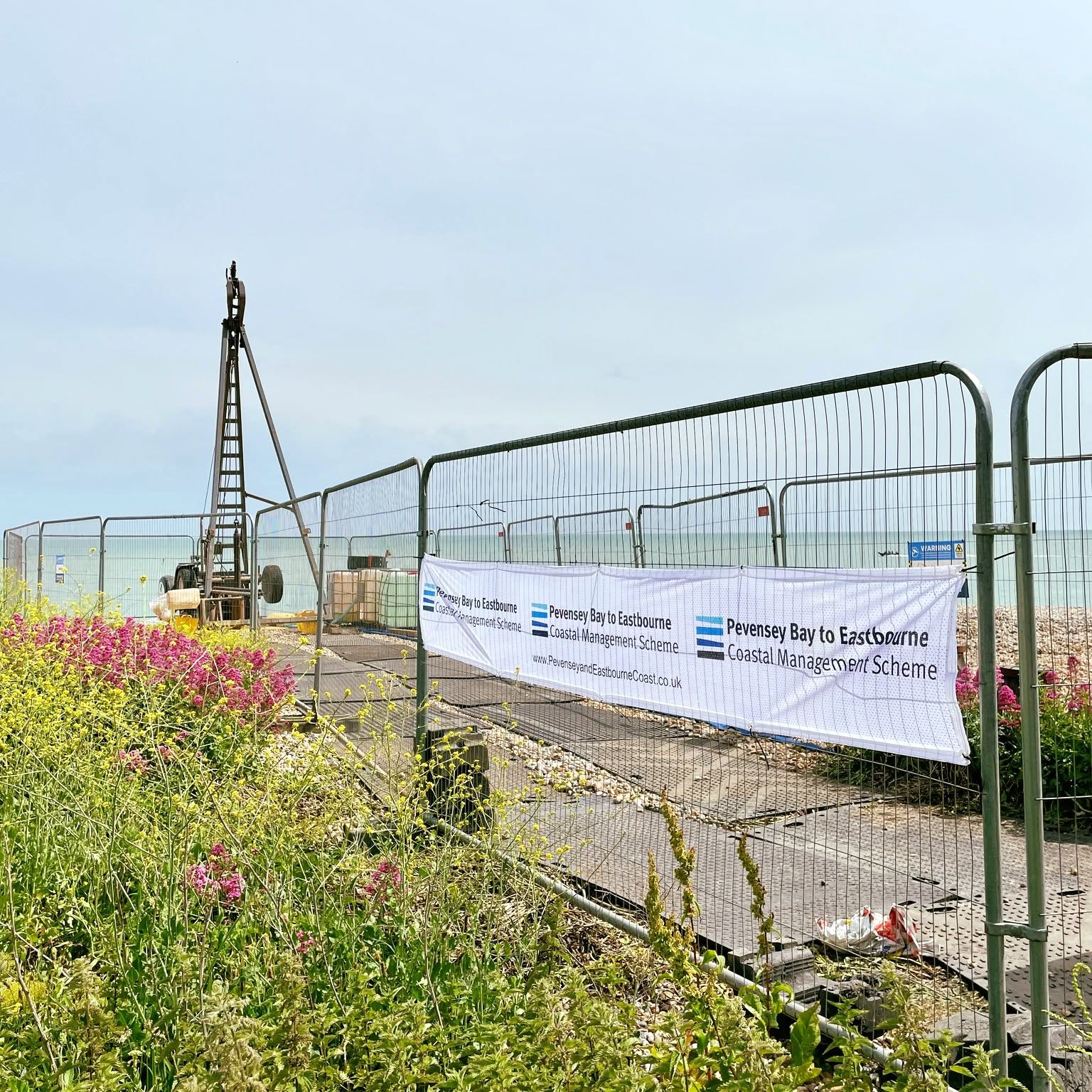 Fenced off area while ground investigations take place. Drilling equipment on the beach.