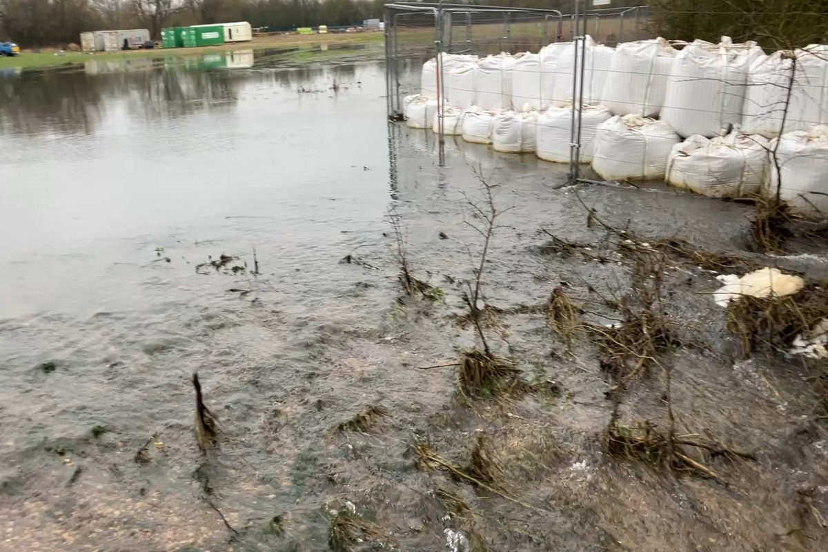This video taken 5 February shows how the jumbo sandbag wall is working well to retain the waste, preventing it from entering the watercourse. You can see the waste in the background. 