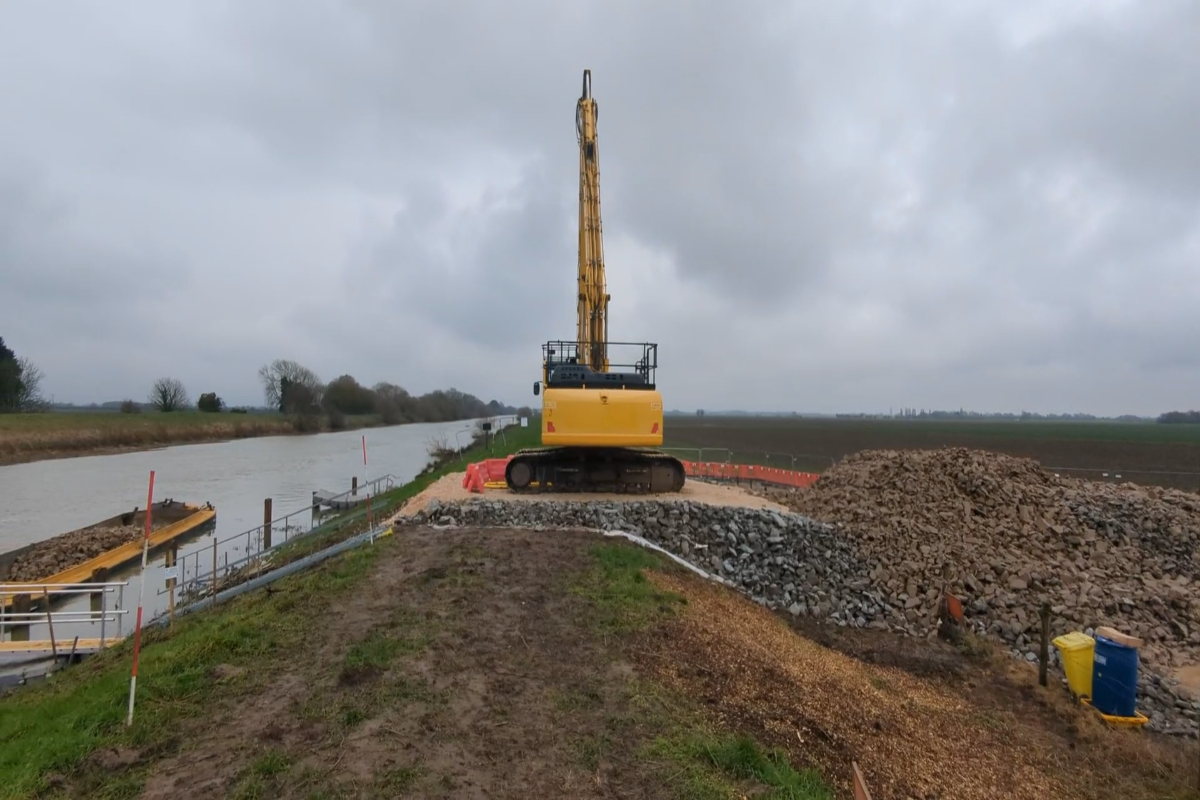 Stone being loaded onto a barge ready to be transported for embankment toe works. 