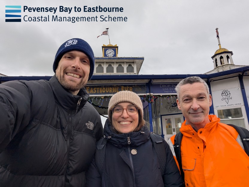 Members of the project team standing at Eastbourne Pier