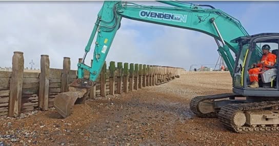 Ground investigations work using an excavator on the beach