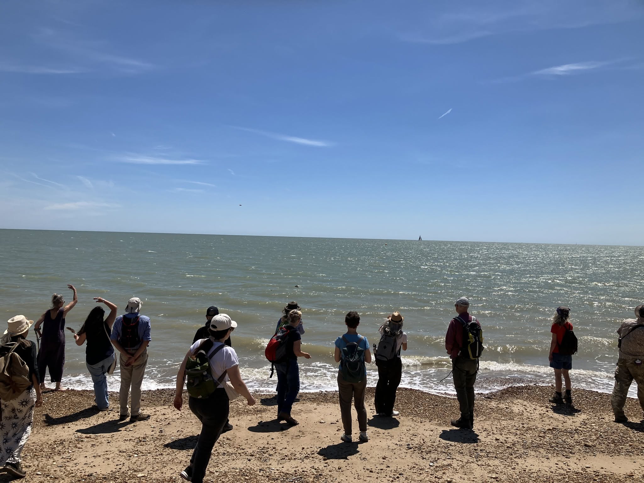 Walkers at the Watercycle event, on the beach in Pevensey