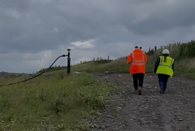 A member of Environment Agency staff and a Wiltshire Council Environmental Health officer walking on site at Lower Compton Landfill site