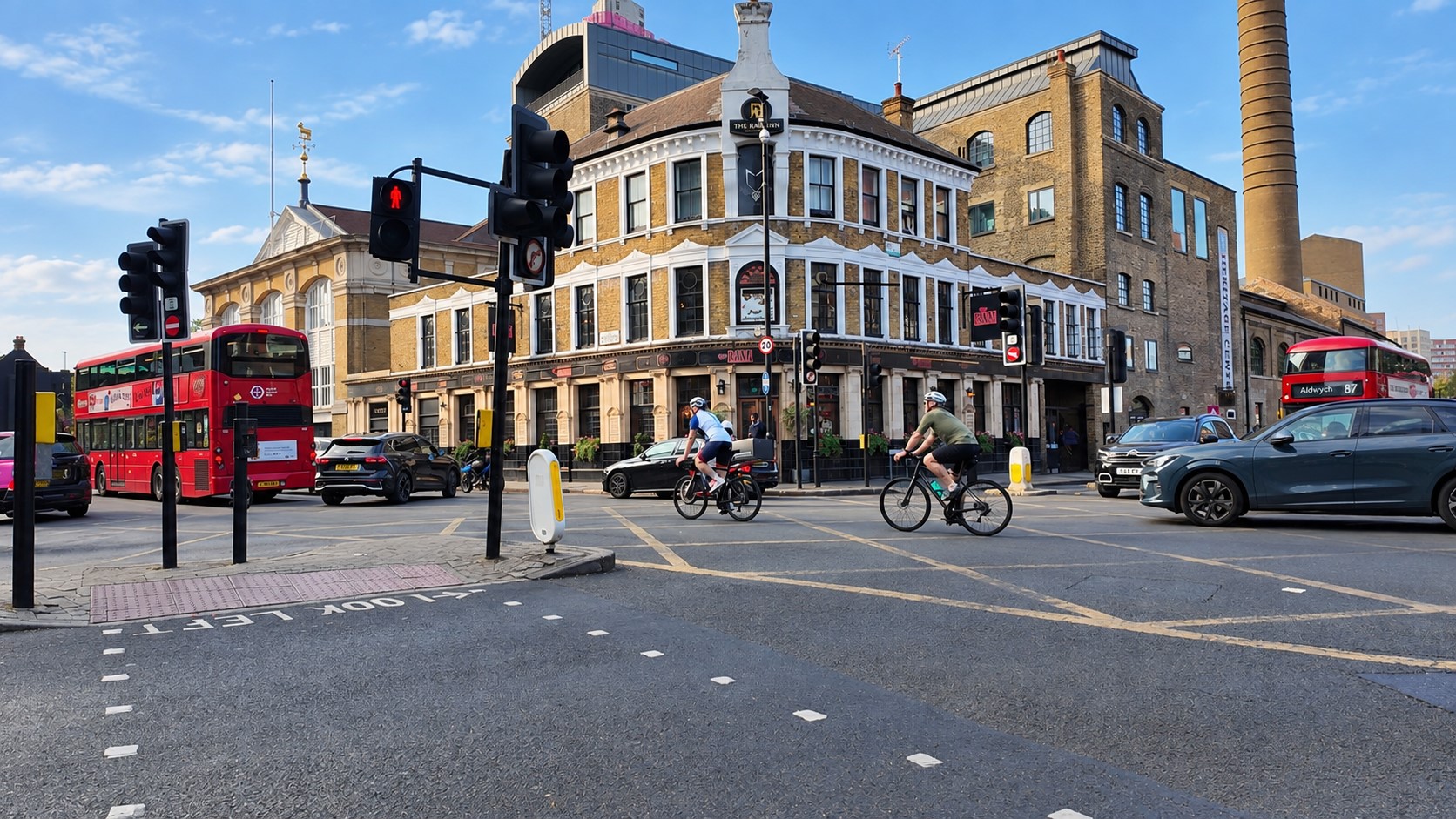 Wandsworth High Street, crossing by Southside with cyclists, buses and cars