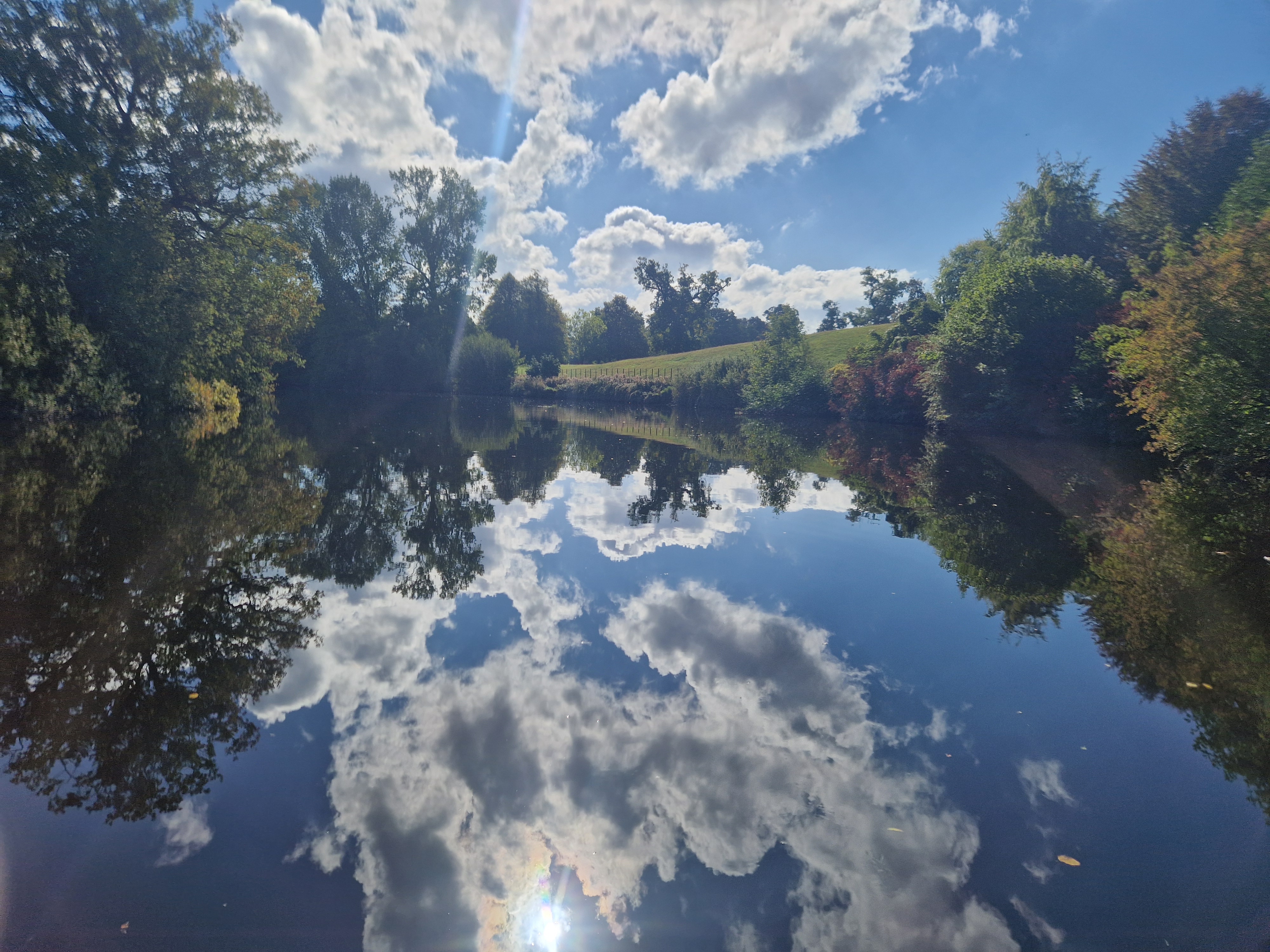 Picture of the River Dee with clouds reflecting in water