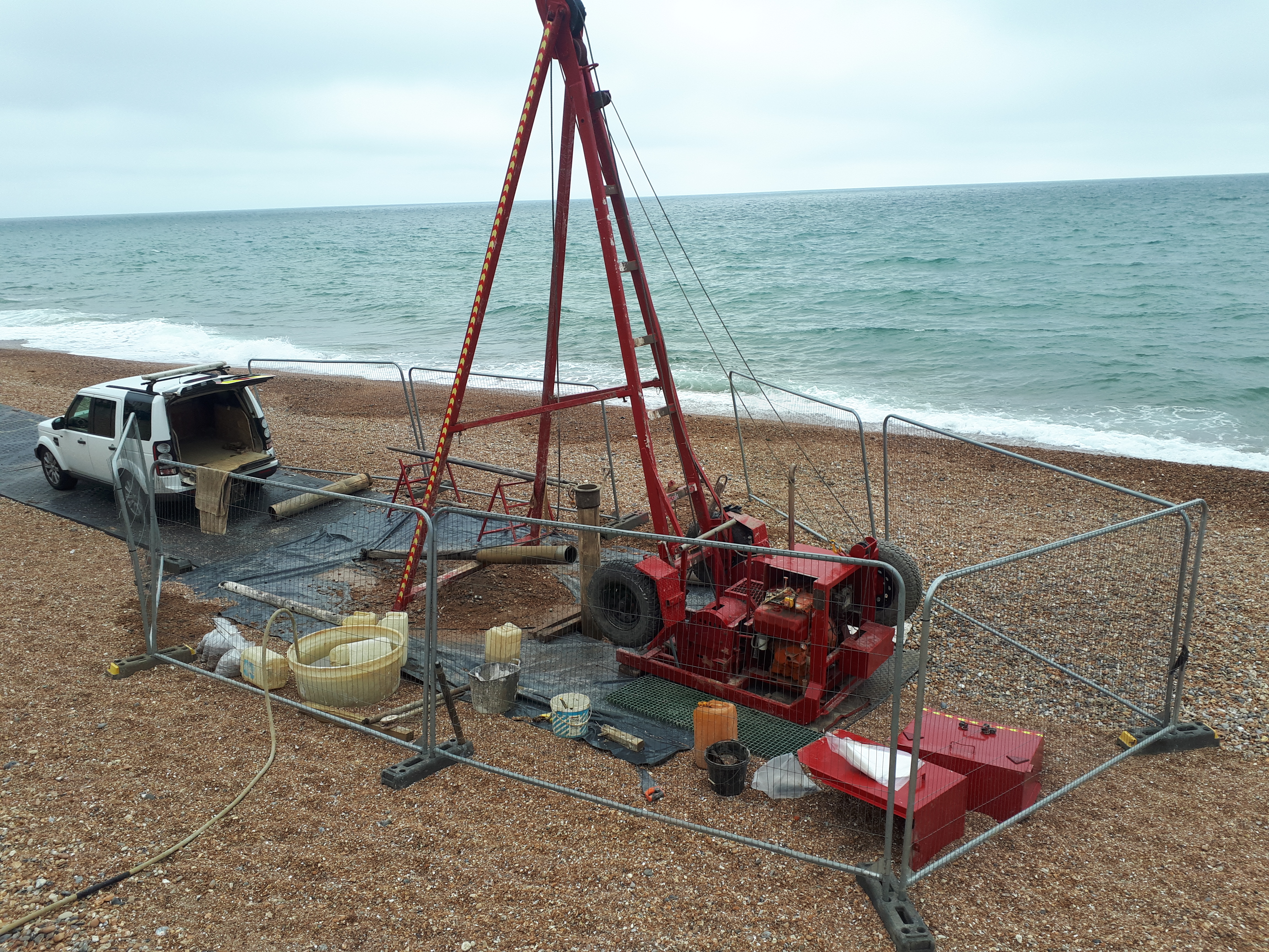 Typical set-up for beach investigations, including drilling equipment and temporary safety fencing