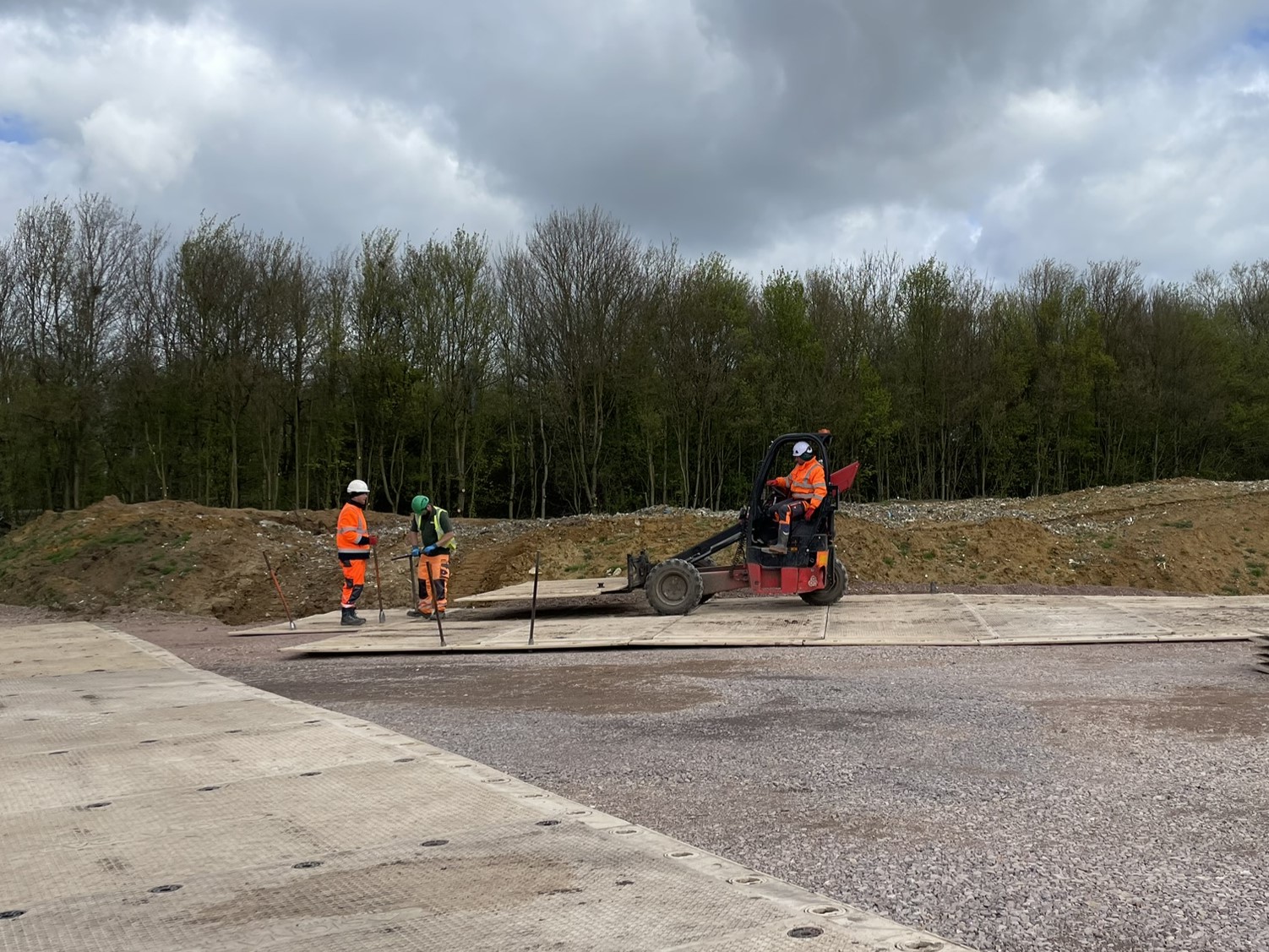 image showing the laying of track matting on site