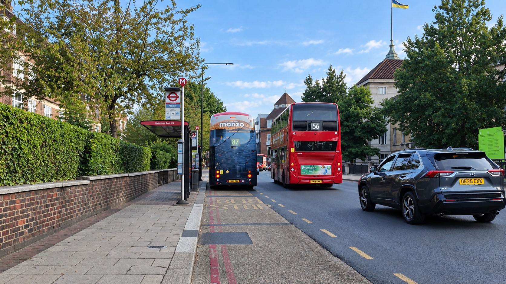 Fairfield Street stop M with buses 87 156 and a car 