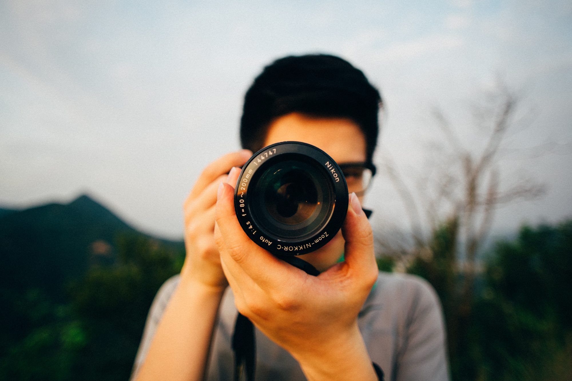 Male photographer with a Nikon camera