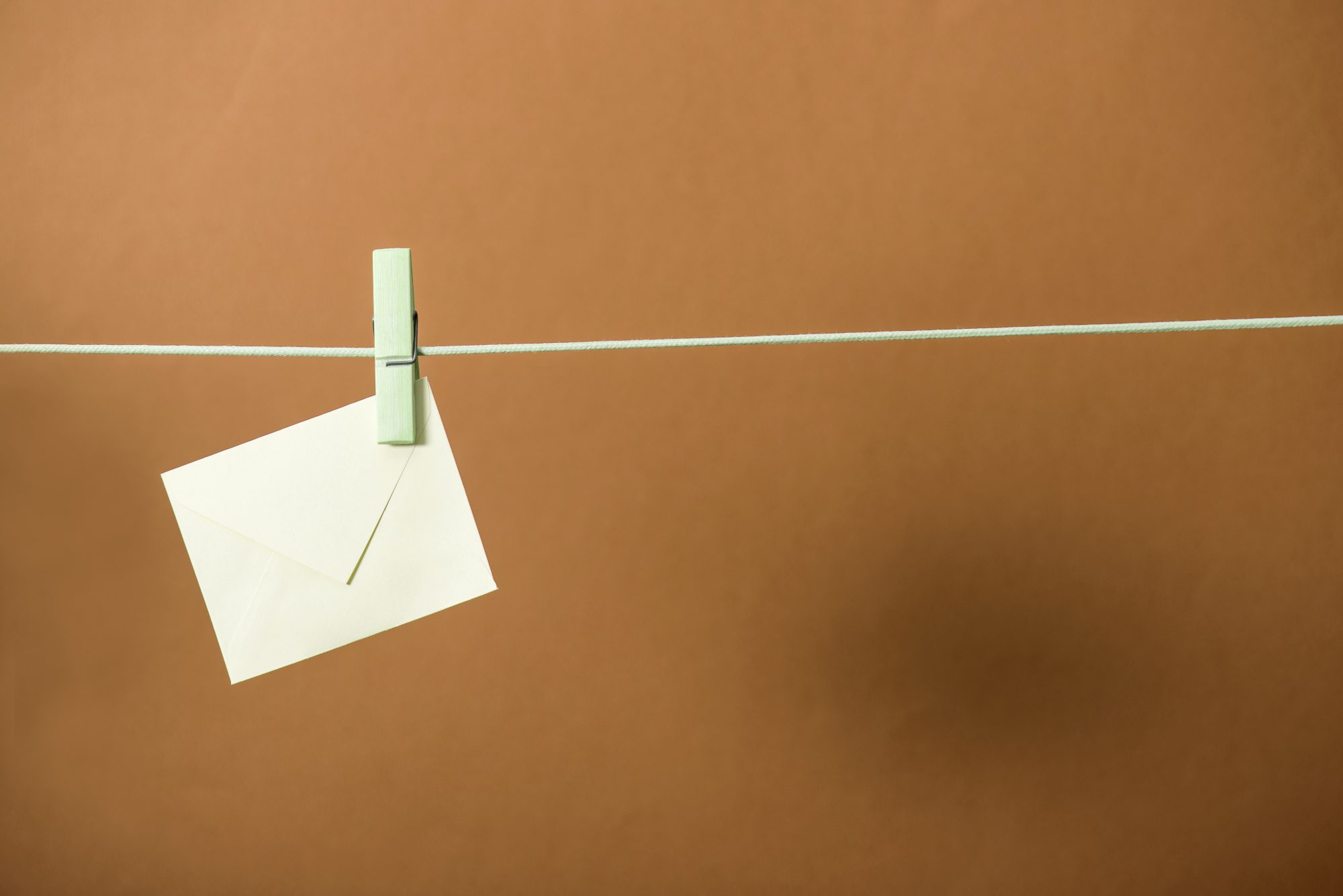 Research article letter attached by a wooden peg to string