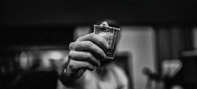 Hand holding out money