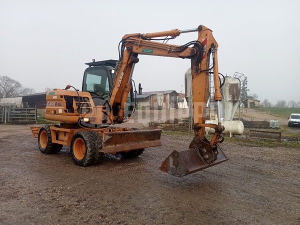 Picture of the Case WX95 with 4 excavator buckets and forks 
