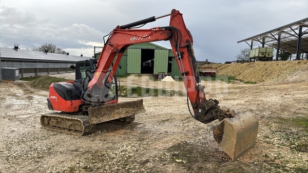 Picture of the Kubota KX080-4 with 3 excavator buckets