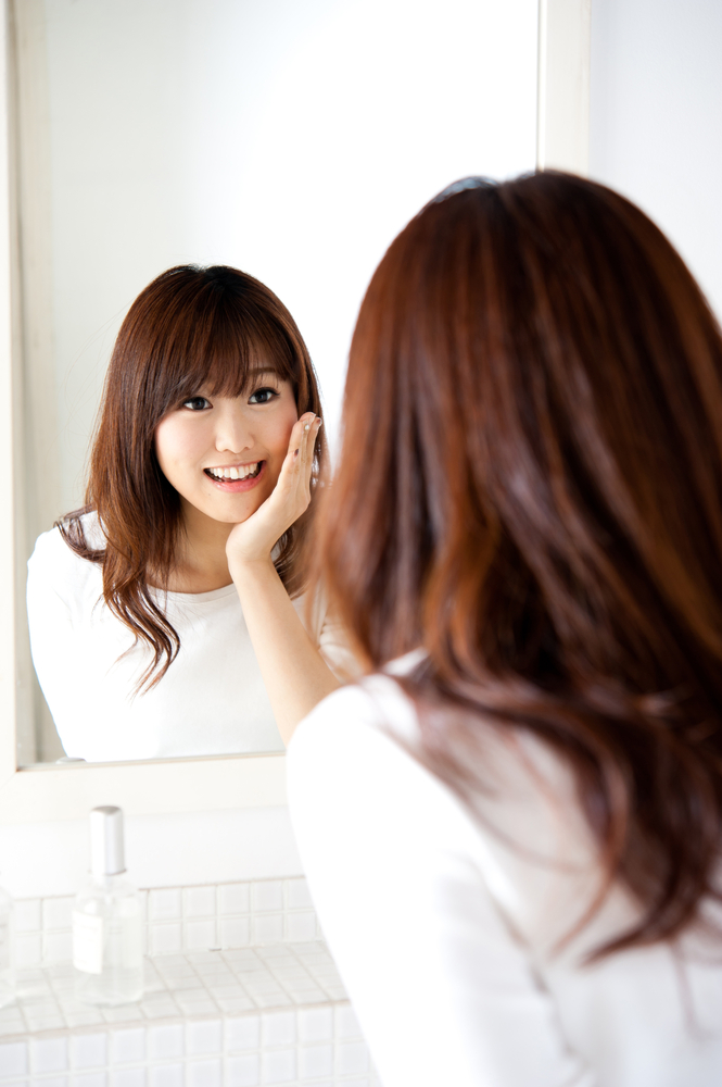 Reflection Woman talking to mirror