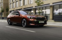 BMW 5 Series Touring, 2026, front, action