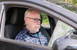 Elderly driver using a map