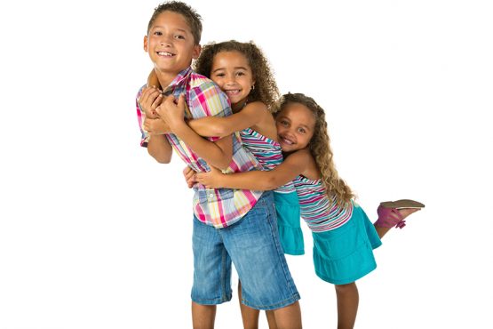 3 siblings hugging