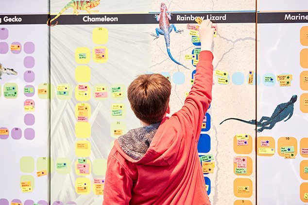 child pinning on board