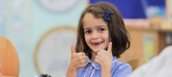 Girl giving thumbs up