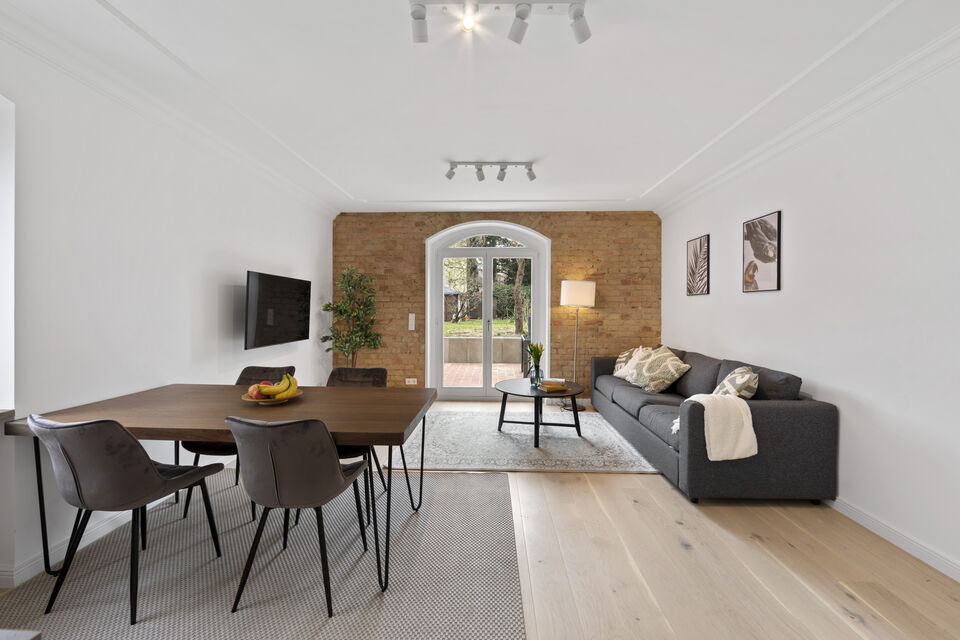 Furnished apartment, living room with brick wall in Berlin Weißensee