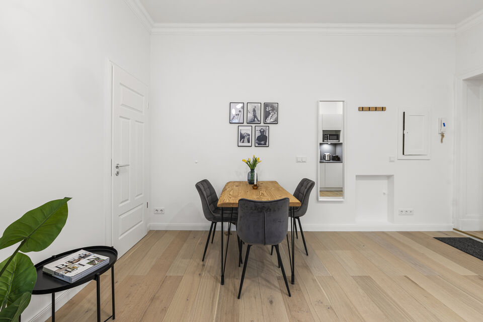 Furnished apartment, dining room with wooden table in Berlin Friedrichshain