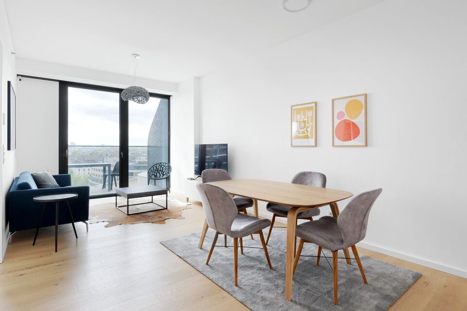 Furnished apartment, living room with panoramic windows in Frankfurt Ostend