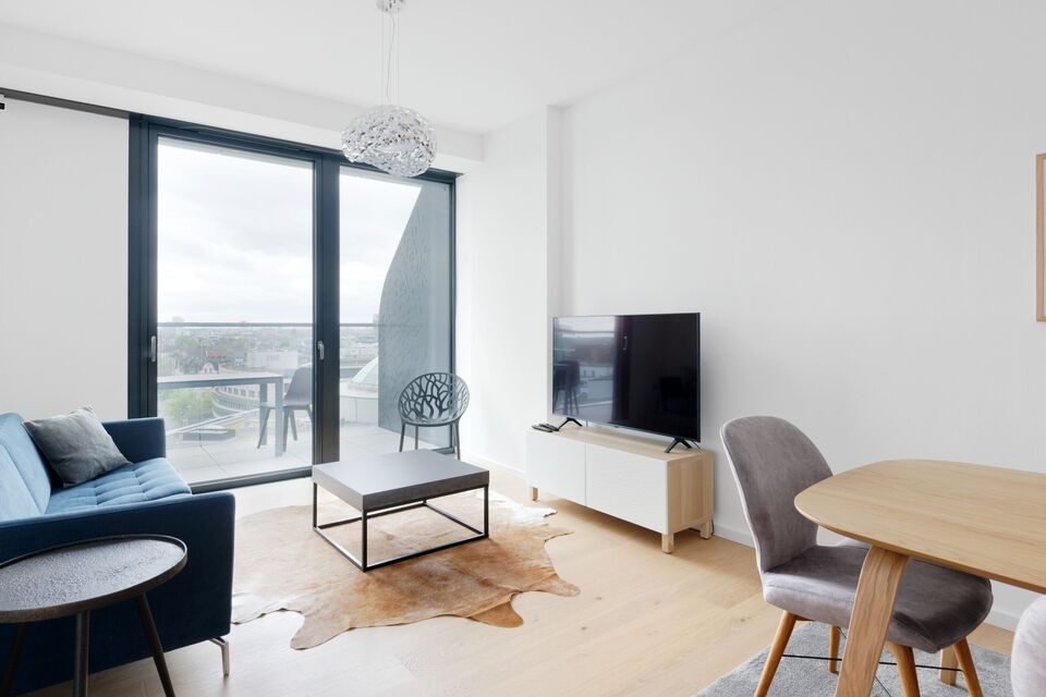 Furnished apartment, living room with panoramic windows in Frankfurt Ostend