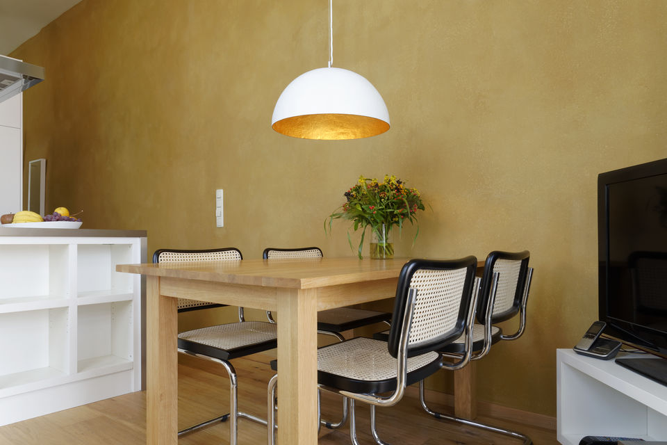 Furnished apartment, dining room with wooden table in Berlin Friedrichshain