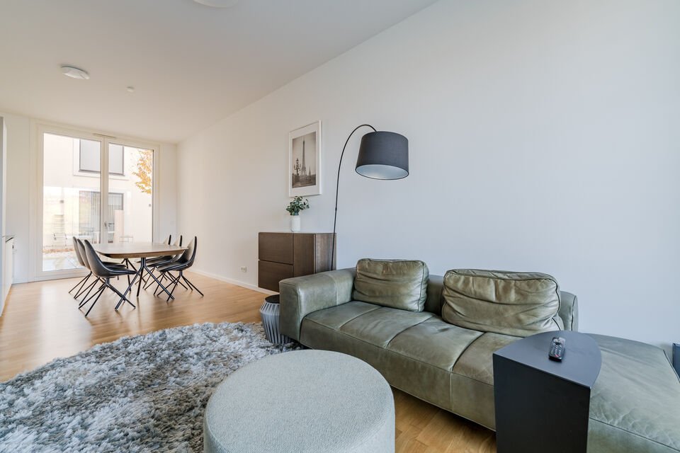 Furnished apartment, living room with leather sofa in Berlin Mitte