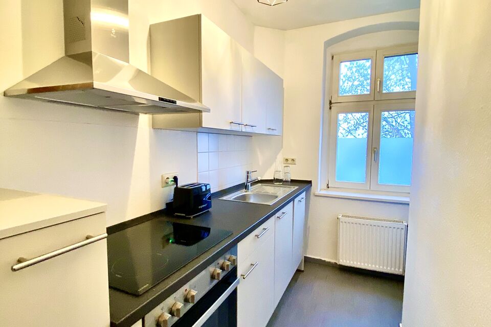 Furnished apartment, kitchen with window view in Berlin Lichtenberg