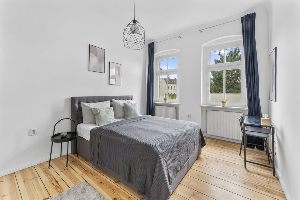 Furnished apartment, bedroom with wooden flooring in Berlin Lichtenberg