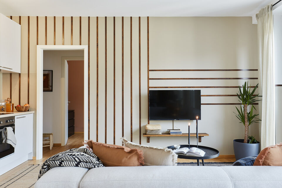 Furnished apartment, living room with wooden slat wall in Berlin Mitte