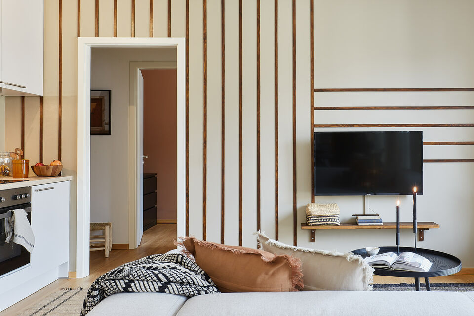 Furnished apartment, living room with wooden slat wall in Berlin Mitte