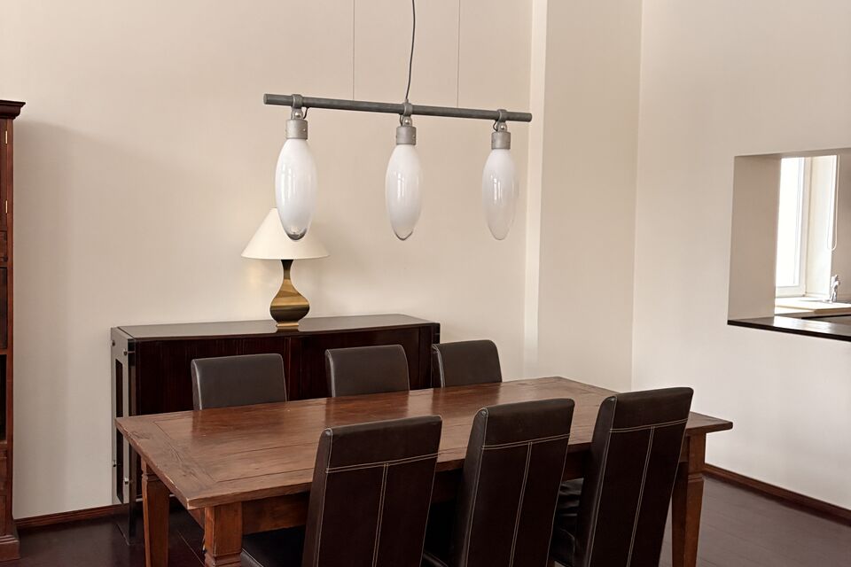 Furnished apartment, dining room with wooden table in Berlin Prenzlauer Berg