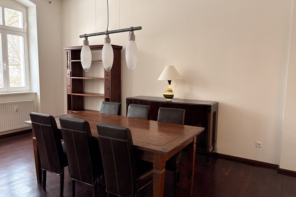 Furnished apartment, dining room with wooden table in Berlin Prenzlauer Berg