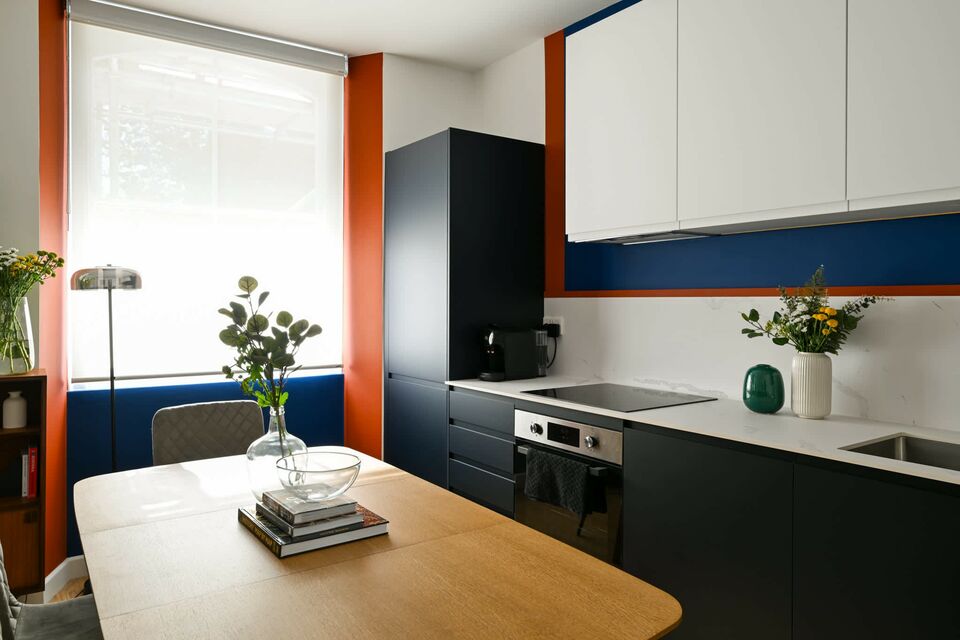 Furnished apartment, kitchen with bold color accents in London City of London