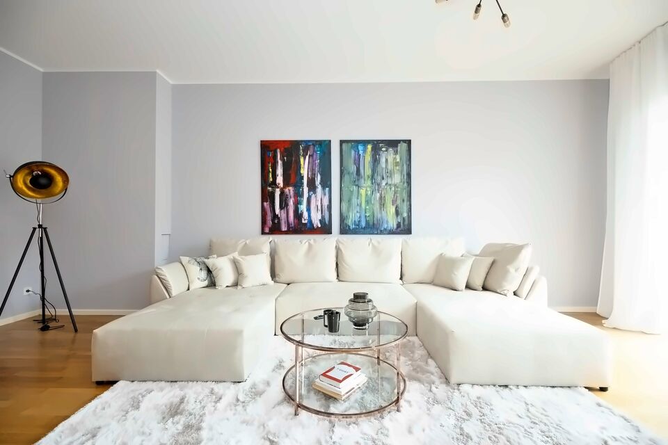 Luxury apartment, living room with spacious corner sofa in Berlin Mitte