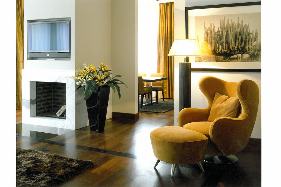 Furnished apartment, living room with designer armchair in Berlin Grunewald