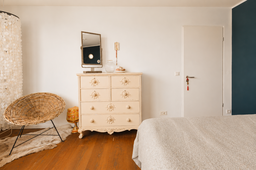 Furnished apartment, bedroom with wooden dresser in Berlin Friedrichshain