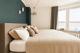Furnished apartment, bedroom with green accent wall in Berlin Friedrichshain