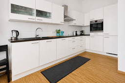Furnished apartment, kitchen with white cabinetry in Berlin Prenzlauer Berg