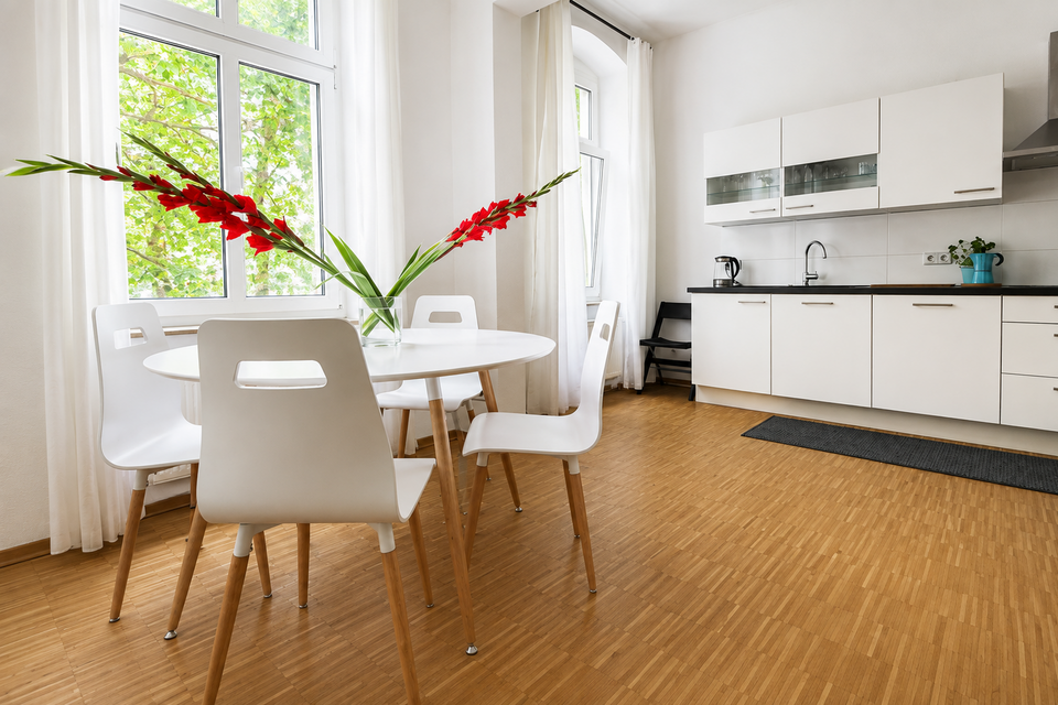 Furnished apartment, dining area and kitchen with orchid arrangement in Berlin Prenzlauer Berg