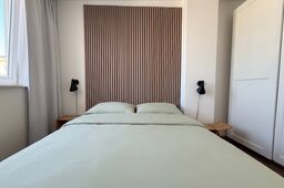 Furnished apartment, bedroom with slatted headboard in Berlin Prenzlauer Berg
