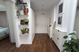 Furnished apartment, corridor with wall shelves and plants in Berlin Prenzlauer Berg