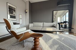 Furnished apartment, living room with Eames lounge chair in Berlin Prenzlauer Berg