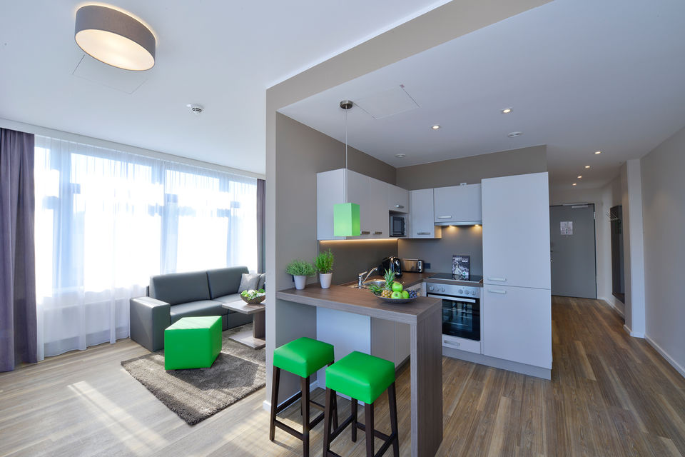 Serviced apartment, living room with open kitchen in Hamburg Groß Borstel