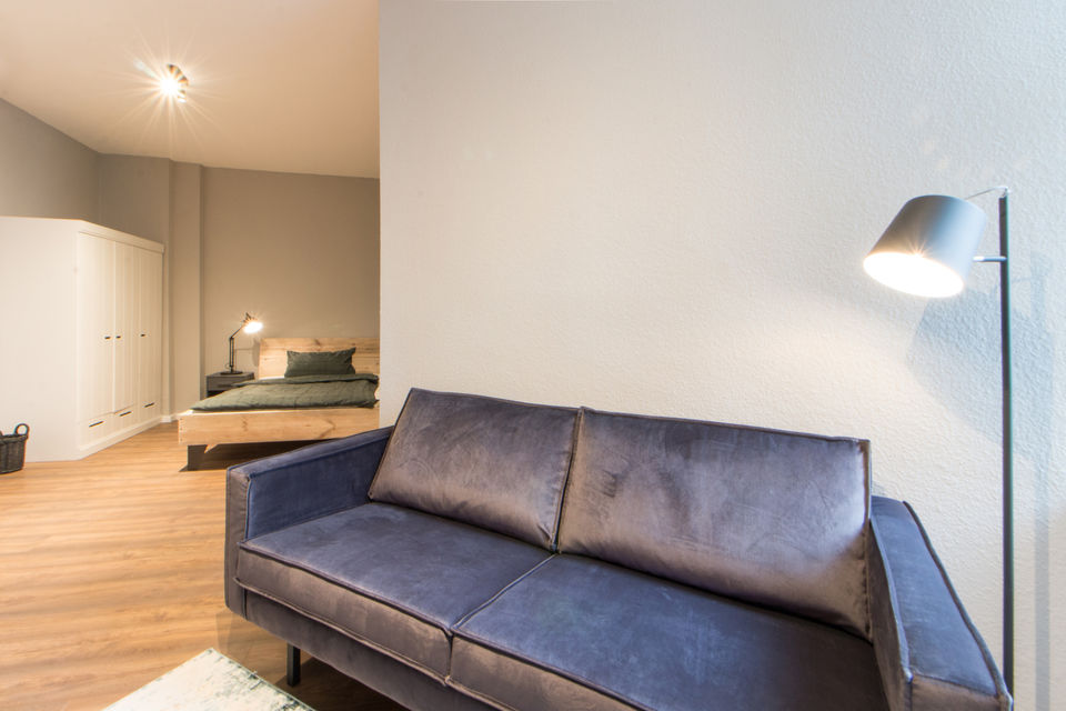 Furnished apartment, living room with designer sofa in Berlin Friedrichshain